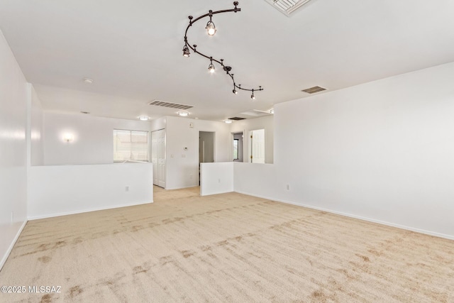 3969 E Agate Knoll Dr, Tucson, AZ 85756 - spare room with light colored carpet and baseboards