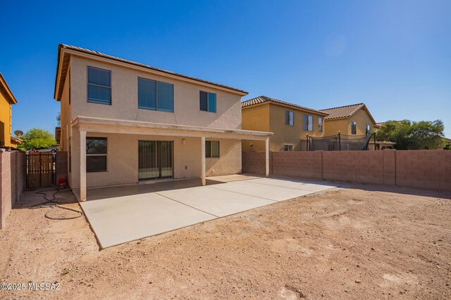 3969 E Agate Knoll Dr, Tucson, AZ 85756 - rear view of house featuring a fenced backyard, stucco siding, and a patio area