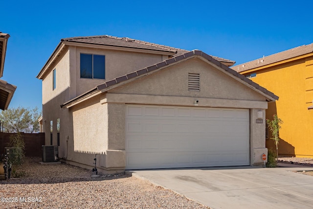 3969 E Agate Knoll Dr, Tucson, AZ 85756 - view of front of home with stucco siding, concrete driveway, an attached garage, and a tile roof