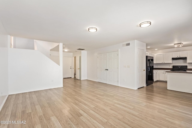 3969 E Agate Knoll Dr, Tucson, AZ 85756 - unfurnished living room featuring light wood finished floors and recessed lighting