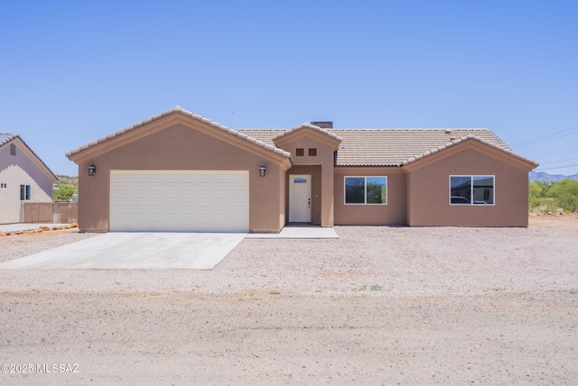 1793 Ariosto Ct, Rio Rico, AZ 85648 - ranch-style house with a tile roof, stucco siding, an attached garage, and concrete driveway