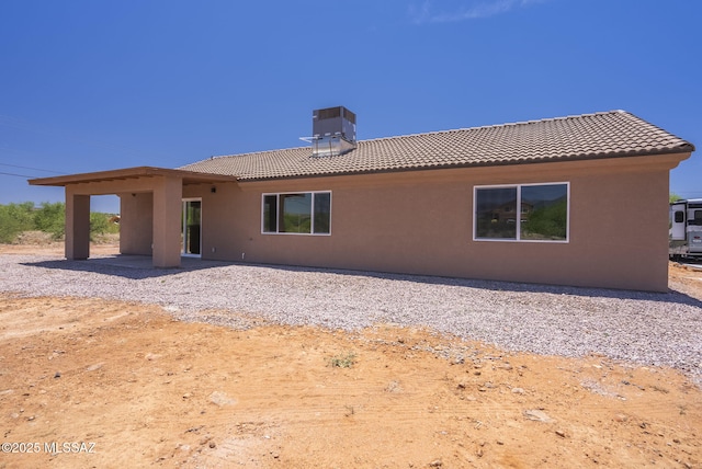 1793 Ariosto Ct, Rio Rico, AZ 85648 - back of property featuring a tiled roof, stucco siding, and a chimney