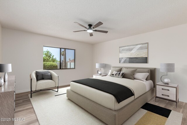 64161 E Santa Catalina Ct, Saddlebrooke, AZ 85739 - bedroom with light wood-type flooring, ceiling fan, and a textured ceiling