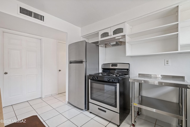 1818 E Mitchell St, Tucson, AZ 85719 - kitchen featuring appliances with stainless steel finishes, under cabinet range hood, white cabinets, open shelves, and light tile patterned flooring