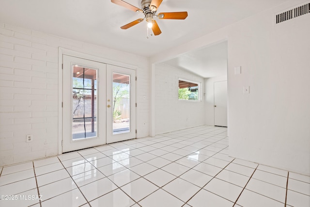 1818 E Mitchell St, Tucson, AZ 85719 - empty room with french doors, a ceiling fan, and light tile patterned flooring