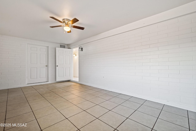 1818 E Mitchell St, Tucson, AZ 85719 - spare room with a ceiling fan and light tile patterned floors