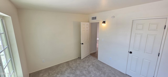 2215 E Bantam Rd, Tucson, AZ 85706 - unfurnished bedroom with light colored carpet