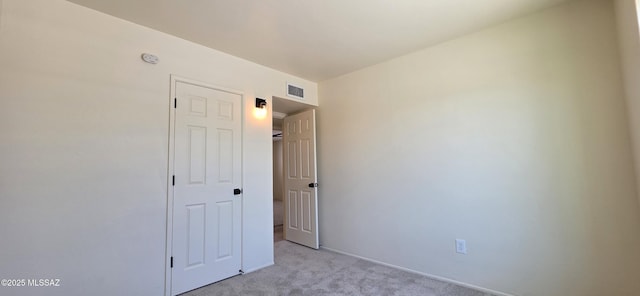 2215 E Bantam Rd, Tucson, AZ 85706 - spare room with light colored carpet and a smoke detector
