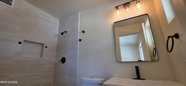 2215 E Bantam Rd, Tucson, AZ 85706 - bathroom featuring a tile shower and vanity