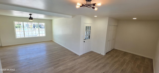 2215 E Bantam Rd, Tucson, AZ 85706 - unfurnished room featuring wood finished floors, a chandelier, and recessed lighting