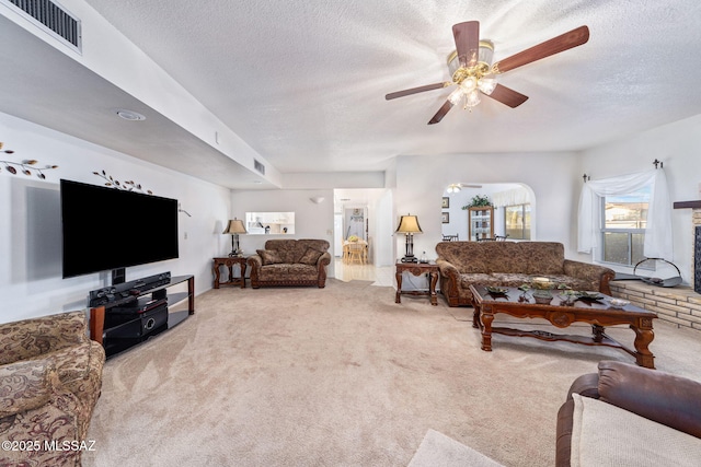 5760 S Stewart Blvd, Tucson, AZ 85706 - carpeted living room featuring ceiling fan and a textured ceiling