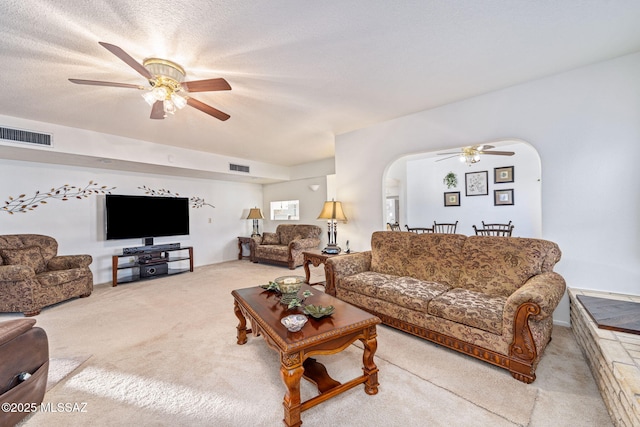5760 S Stewart Blvd, Tucson, AZ 85706 - carpeted living area featuring ceiling fan and arched walkways