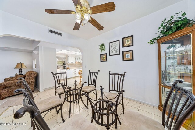 5760 S Stewart Blvd, Tucson, AZ 85706 - dining space featuring arched walkways, light tile patterned flooring, and a ceiling fan