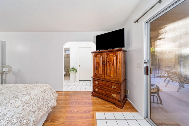 5760 S Stewart Blvd, Tucson, AZ 85706 - bedroom with light wood-style floors, access to outside, and arched walkways