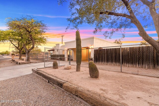 5760 S Stewart Blvd, Tucson, AZ 85706 - view of front of property with a gate and stucco siding