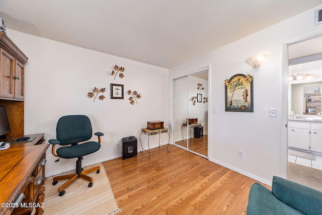 5760 S Stewart Blvd, Tucson, AZ 85706 - office space featuring light wood-type flooring and a textured ceiling