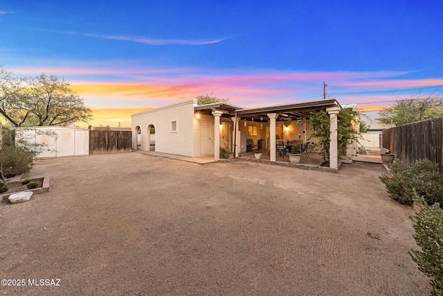 5760 S Stewart Blvd, Tucson, AZ 85706 - back of property featuring a patio, a fenced backyard, and stucco siding