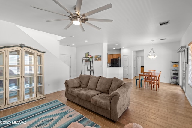 977 S Limestone St, Benson, AZ 85602 - living area with light wood finished floors, a ceiling fan, and recessed lighting
