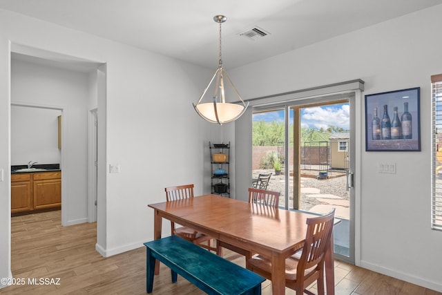 977 S Limestone St, Benson, AZ 85602 - dining room with light wood finished floors and baseboards
