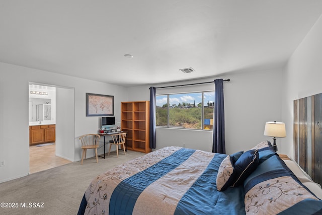 977 S Limestone St, Benson, AZ 85602 - carpeted bedroom with ensuite bathroom and baseboards