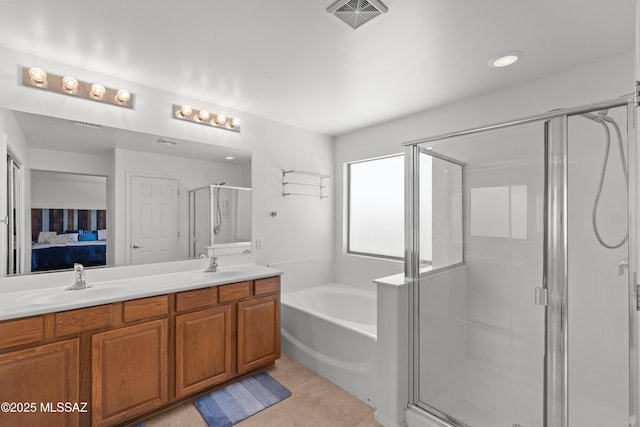 977 S Limestone St, Benson, AZ 85602 - ensuite bathroom featuring a bath, a shower stall, double vanity, and tile patterned floors