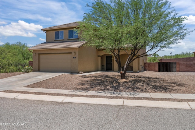 977 S Limestone St, Benson, AZ 85602 - view of front of house with stucco siding, a garage, concrete driveway, and a tiled roof