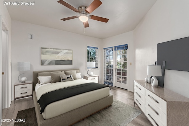 467 S Stephanie Loop, Tucson, AZ 85745 - bedroom featuring access to outside, light wood-style flooring, and ceiling fan