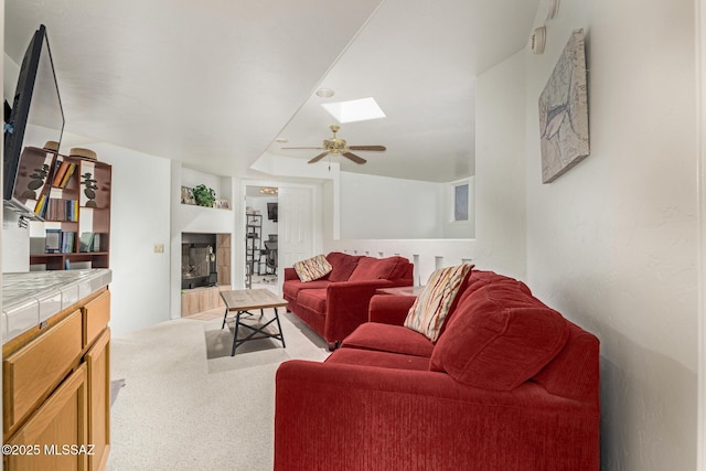467 S Stephanie Loop, Tucson, AZ 85745 - living room with a skylight, ceiling fan, and a tile fireplace