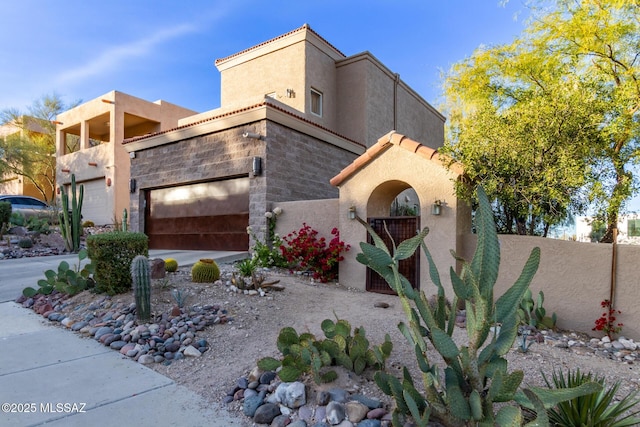 467 S Stephanie Loop, Tucson, AZ 85745 - view of front facade featuring a garage, stucco siding, and driveway