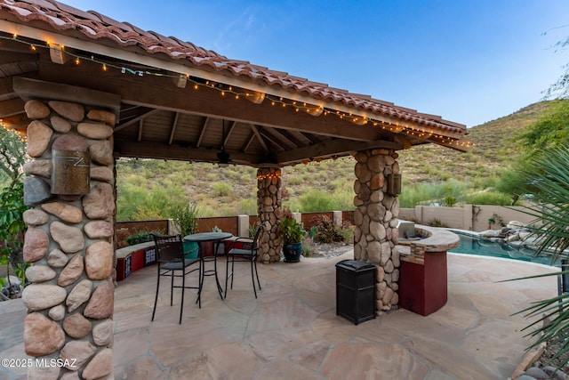 467 S Stephanie Loop, Tucson, AZ 85745 - fenced backyard featuring a gazebo, a patio, outdoor dining space, and a mountain view