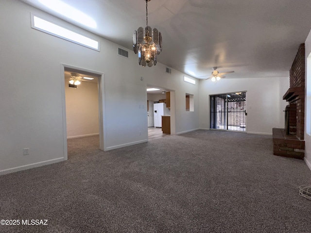1339 W Pastime Rd, Tucson, AZ 85705 - unfurnished living room with ceiling fan, carpet floors, and a fireplace