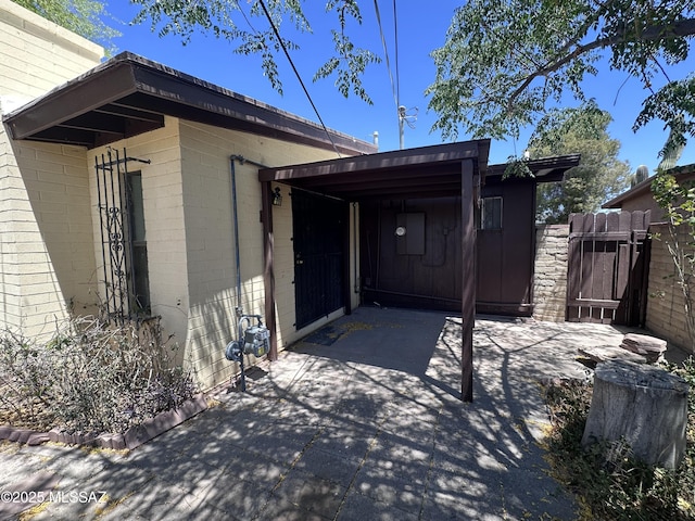 1339 W Pastime Rd, Tucson, AZ 85705 - view of patio / terrace featuring a gate and a carport