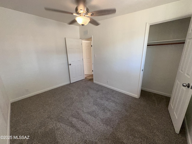 1339 W Pastime Rd, Tucson, AZ 85705 - unfurnished bedroom with dark colored carpet, a closet, and a ceiling fan