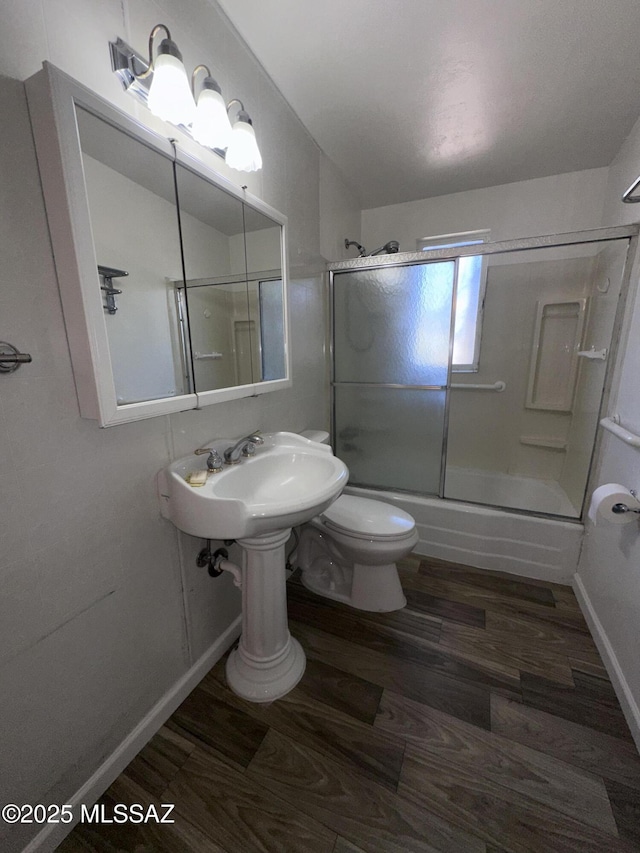 1339 W Pastime Rd, Tucson, AZ 85705 - bathroom with wood finished floors and shower / bath combination with glass door
