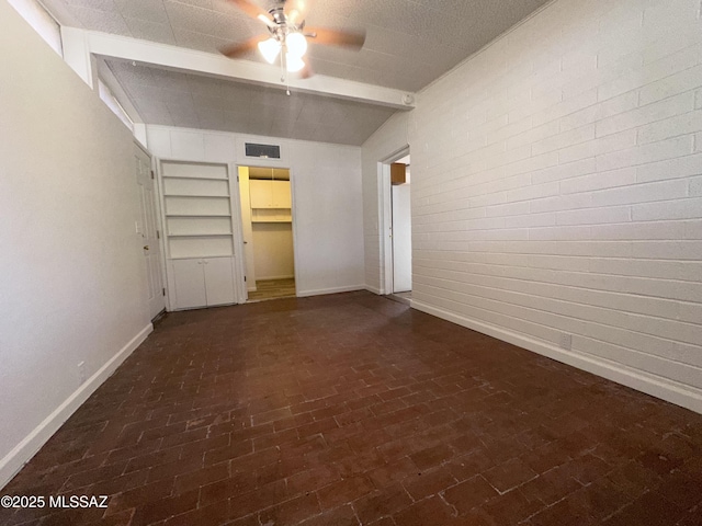 1339 W Pastime Rd, Tucson, AZ 85705 - unfurnished bedroom featuring brick patterned flooring and ceiling fan