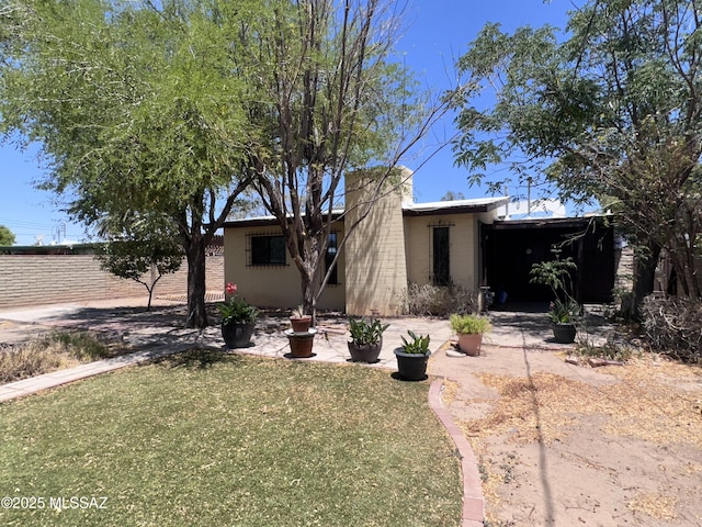 1339 W Pastime Rd, Tucson, AZ 85705 - mid-century modern home with a front lawn
