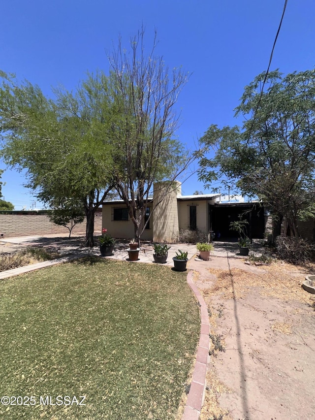 1339 W Pastime Rd, Tucson, AZ 85705 - mid-century home featuring a front lawn