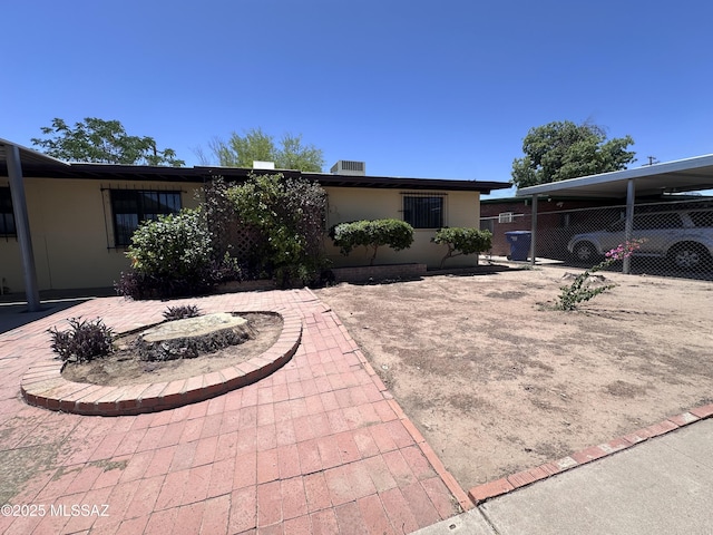 1339 W Pastime Rd, Tucson, AZ 85705 - view of front of home featuring a carport and a patio