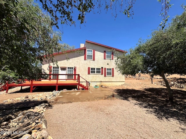 10487 E Turkey Creek Rd, Pearce, AZ 85625 - rear view of property featuring a wooden deck and stucco siding