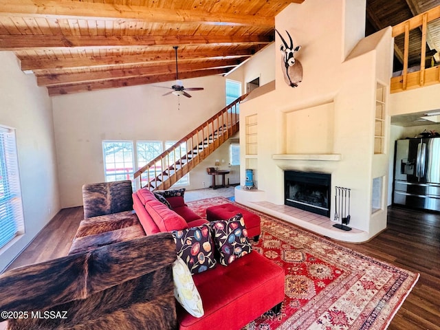 10487 E Turkey Creek Rd, Pearce, AZ 85625 - living area with a wood ceiling with exposed beams, stairs, a fireplace, wood finished floors, and ceiling fan