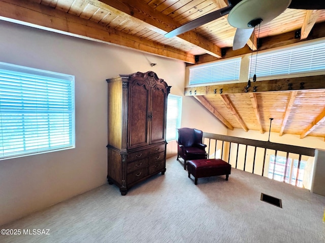 10487 E Turkey Creek Rd, Pearce, AZ 85625 - living area featuring a wood ceiling with exposed beams, carpet floors, and a ceiling fan