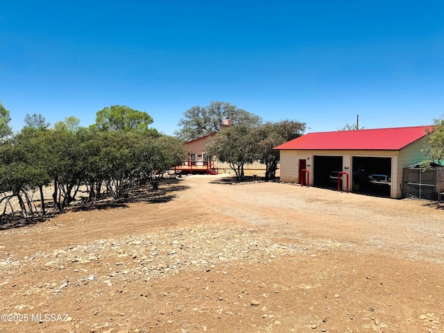 10487 E Turkey Creek Rd, Pearce, AZ 85625 - view of yard with a garage, an outdoor structure, and dirt driveway