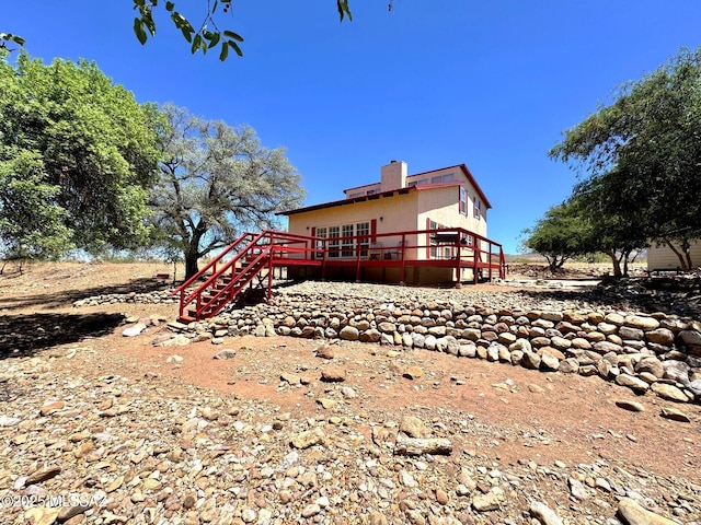 10487 E Turkey Creek Rd, Pearce, AZ 85625 - back of house with a wooden deck, stairs, and a chimney