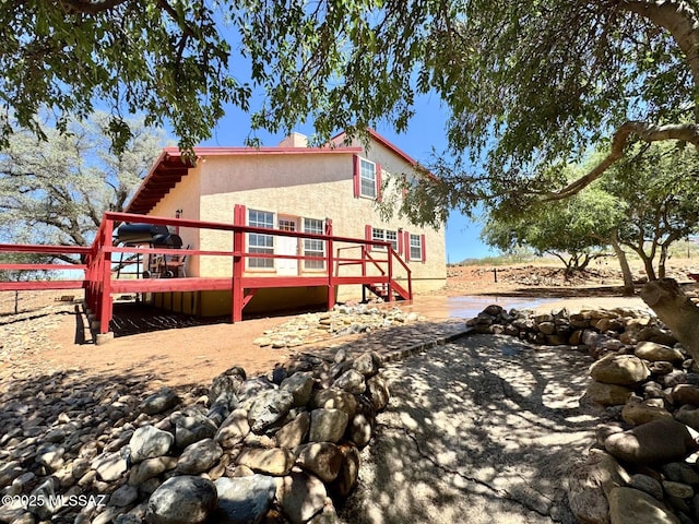 10487 E Turkey Creek Rd, Pearce, AZ 85625 - view of side of property with a deck and stucco siding