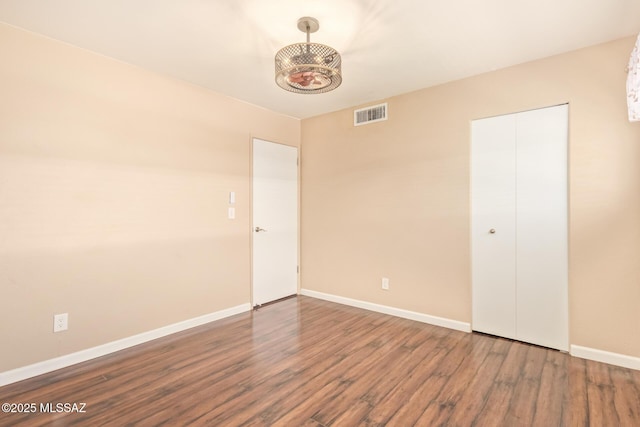 1312 S Avenida Polar Unit A6, Tucson, AZ 85710 - unfurnished bedroom featuring wood finished floors and a closet