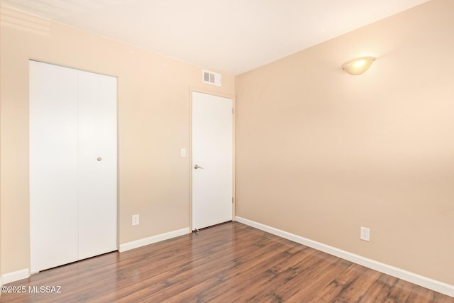 1312 S Avenida Polar Unit A6, Tucson, AZ 85710 - unfurnished bedroom featuring wood finished floors and a closet