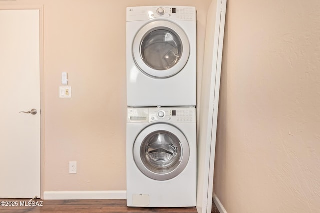 1312 S Avenida Polar Unit A6, Tucson, AZ 85710 - laundry room featuring stacked washer / dryer and wood finished floors