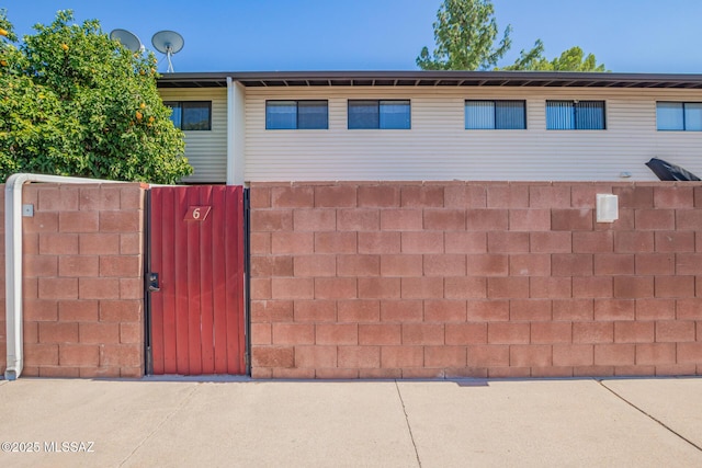 1312 S Avenida Polar Unit A6, Tucson, AZ 85710 - view of front facade featuring a gate