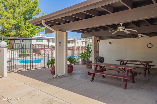 1312 S Avenida Polar Unit A6, Tucson, AZ 85710 - view of patio featuring a ceiling fan and a community pool