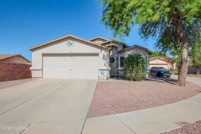 6075 N Applesauce Ct, Tucson, AZ 85741 - ranch-style house with driveway, stucco siding, and a garage